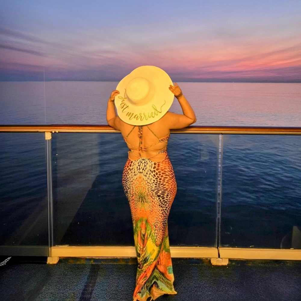 Nagham watching the sunset from the deck of a cruise ship