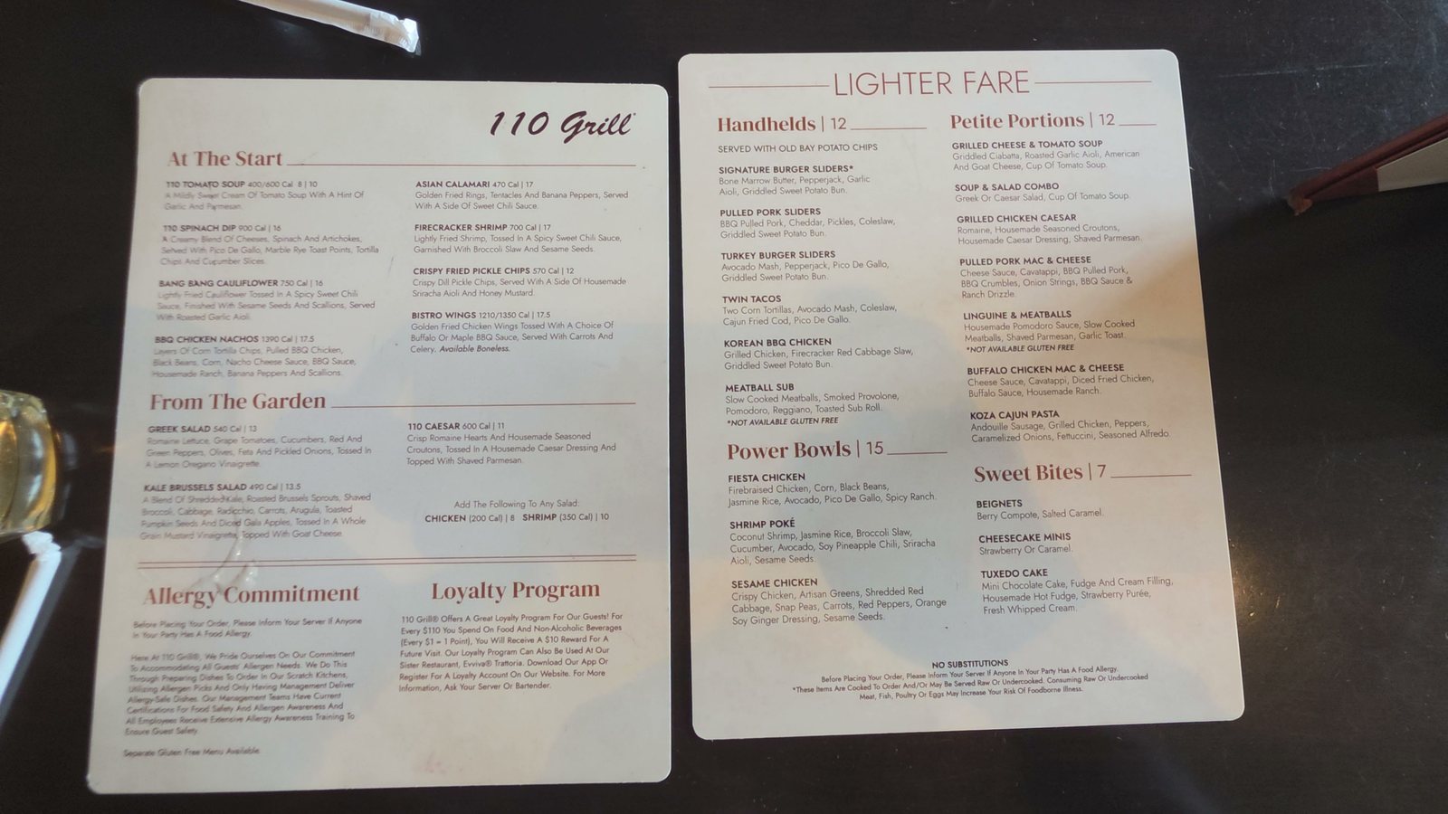 The 110 Grill menu and Lighter Fare menu on the table