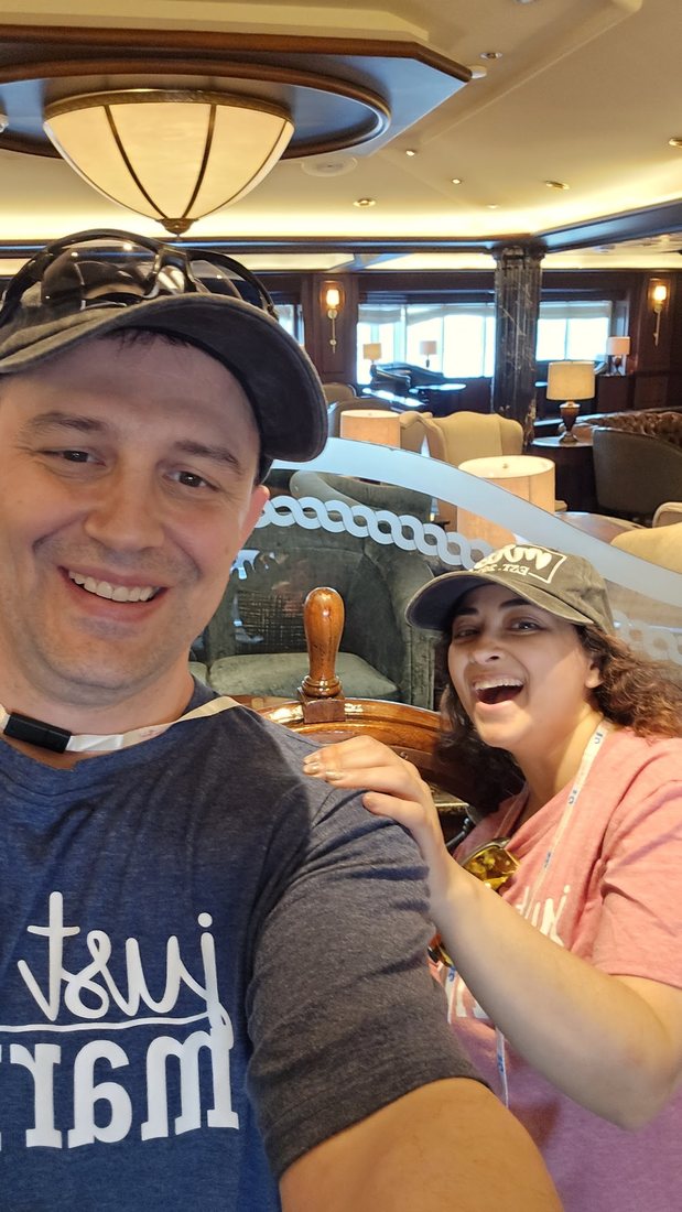 Nick and Nagham in just married shirts on board