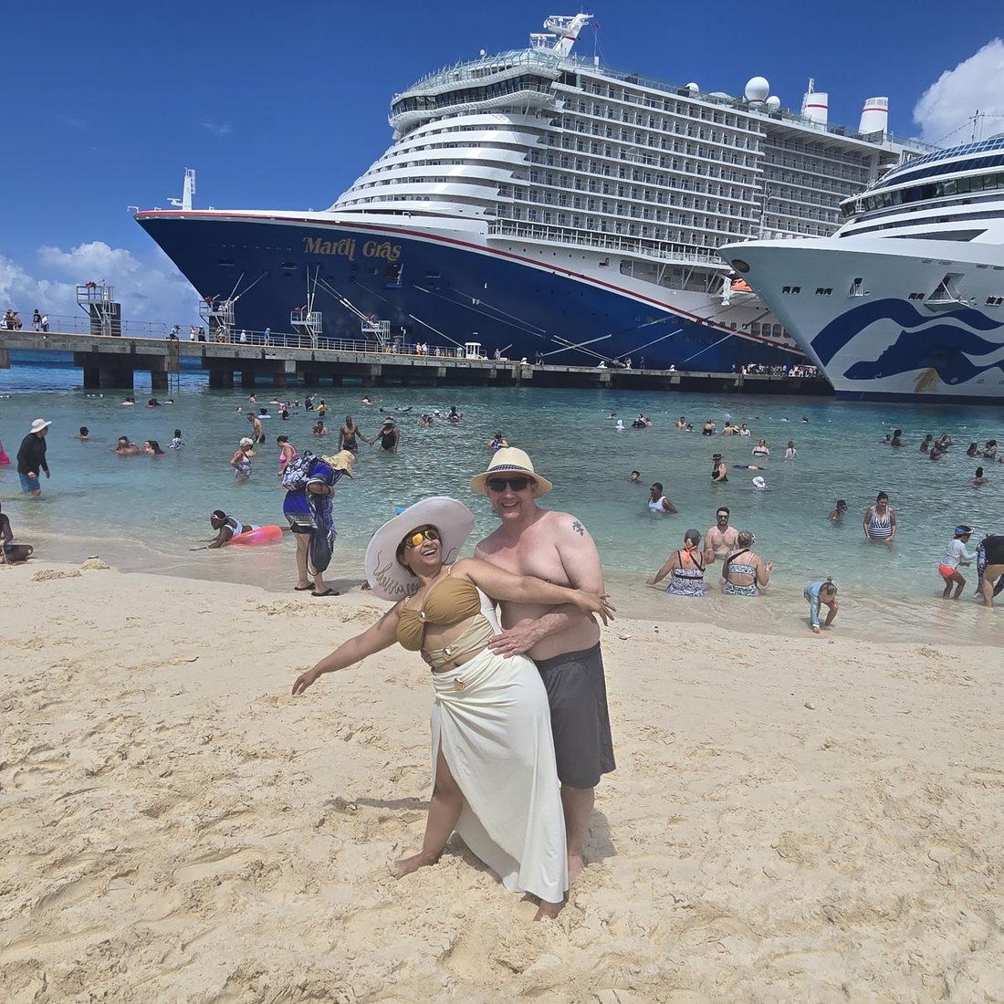 Nick and Nagham on the beach at Grand Turk with the ship behind